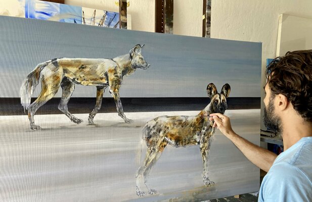 Everett Duarte in the Studio: in the studio, painting Wild Dogs