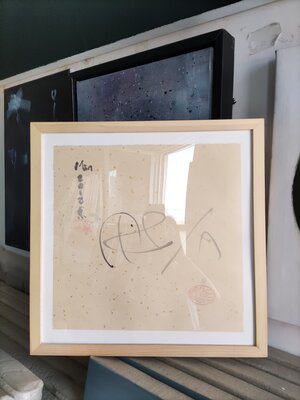 Min Zou in the Studio: in suit under plexiglass near the windom
