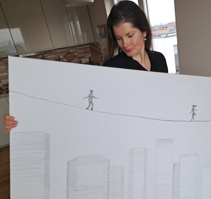 Painter Coded in the Studio: The artist holds 'Over the City #1' in their hands.