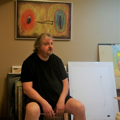 Vladimir Kolosov in the Studio: In studio, looking at work in progress.