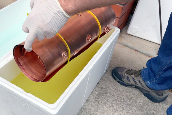 Malcolm Koch in the Studio: There is a curve for each structural action. Here, the surfaces, holes, and other hidden characteristics of the curled-up copper sheet are being oxidised using a potassium sulphide bath.