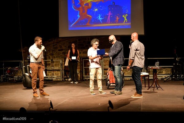 Alessandro Piras in the Studio: Montefiore Conca 2020, I receive an award for creating the graphic design and illustration for Rocca di Luna,  the annual event that is celebrated every year from 1988.