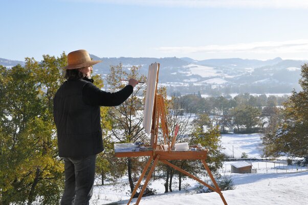 Anne Baudequin in the Studio: Painting from the terrace of the artist's studio, view of the Monts du Velay, Auvergne, France