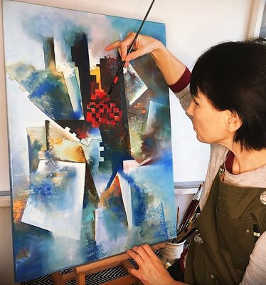 Olga Begisheva K. in the Studio: Olga Begisheva K. in her art studio. The process of creating the abstract painting "Skyscrapers".