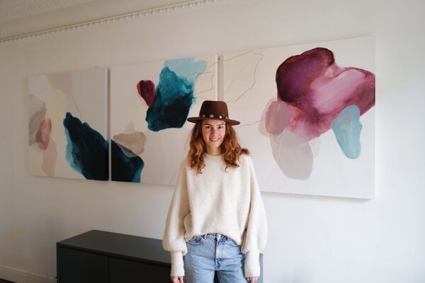 Julia A. Etedi in the Studio: Julia A. Etedi and a commissioned artpiece made of a tryptic