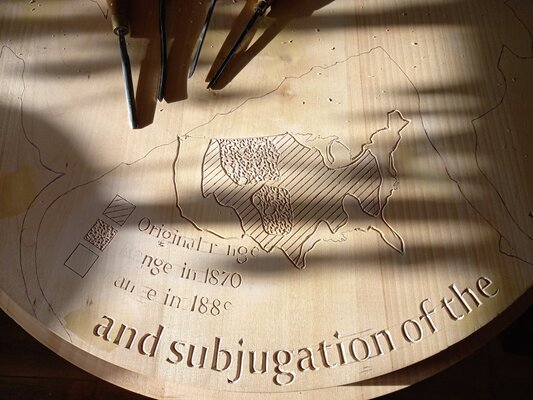 Barry Davies RCA in the Studio: Carving an inscription for the base of my current project  -  a commemorative statue commemorating 'The slaughter of the American bison and the subjugation of the Indigenous Peoples'.