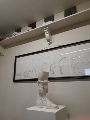 Barry Davies RCA in the Studio: A classical sculpture and a drawing of a proposed statue design of horse evolution.