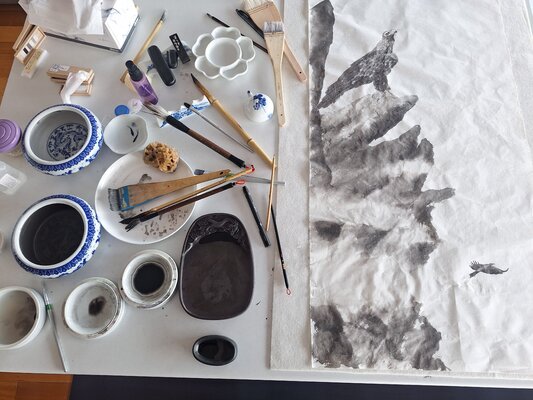 Arlo Mercia in the Studio: The Eagle Scroll in Progress - the creases in the paper are carefully ironed out during the mounting process.