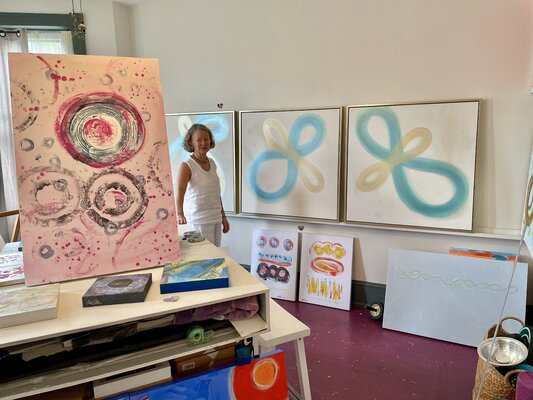 Karin Edgett in the Studio: me standing in my studio next to completed works and up and coming works.