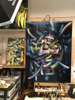 Mark LaRiviere in the Studio: I hang my large paintings from overhead iron heating system pipes using bicycle hooks while I'm not actively working on them.