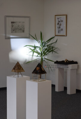Ala Botnarescu in the Studio: View from inside my studio, with resin pyramids in the foreground and graphic artworks in the background.